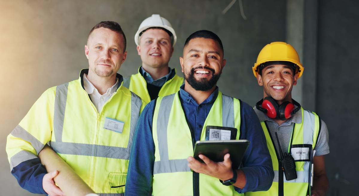 Construction team planning project on tablet