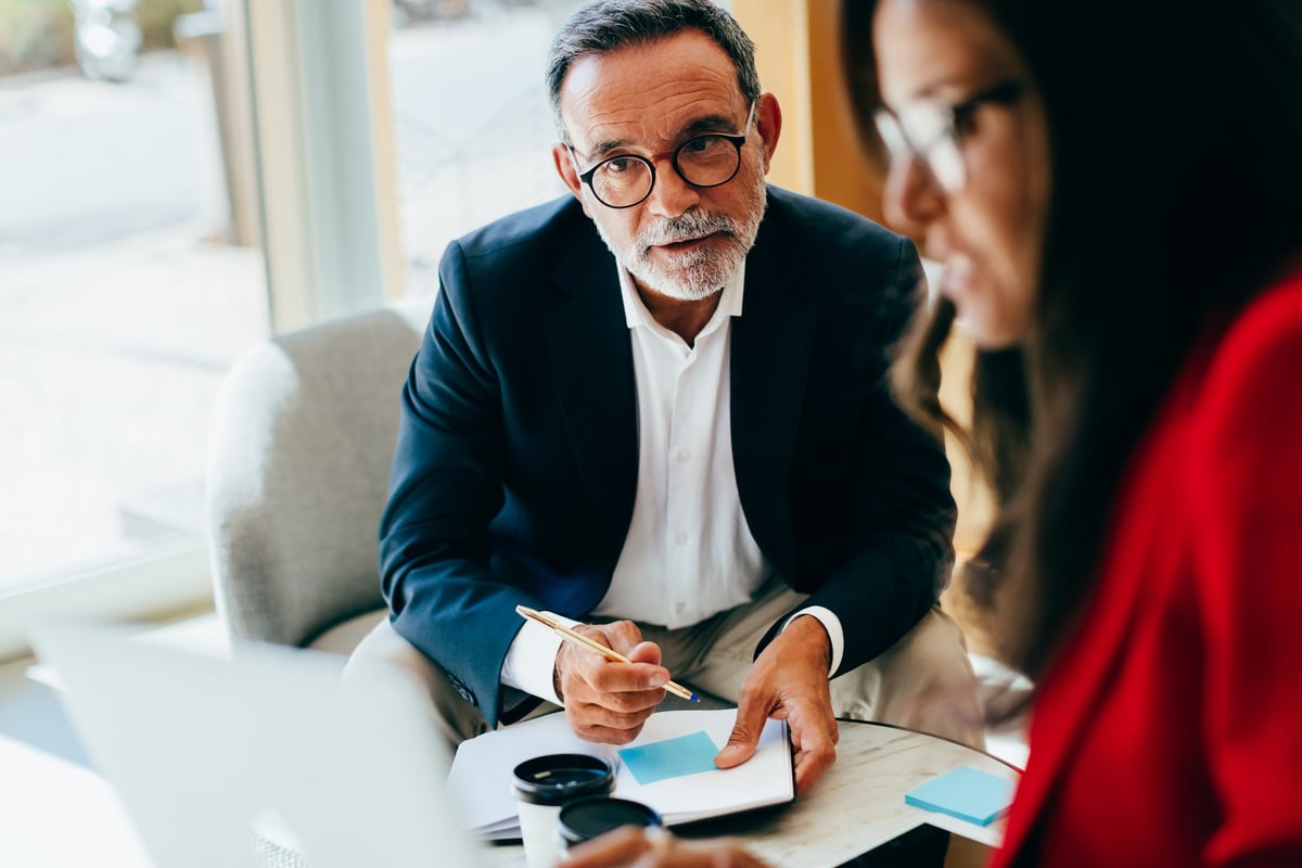 Professional manager conversing in office meeting